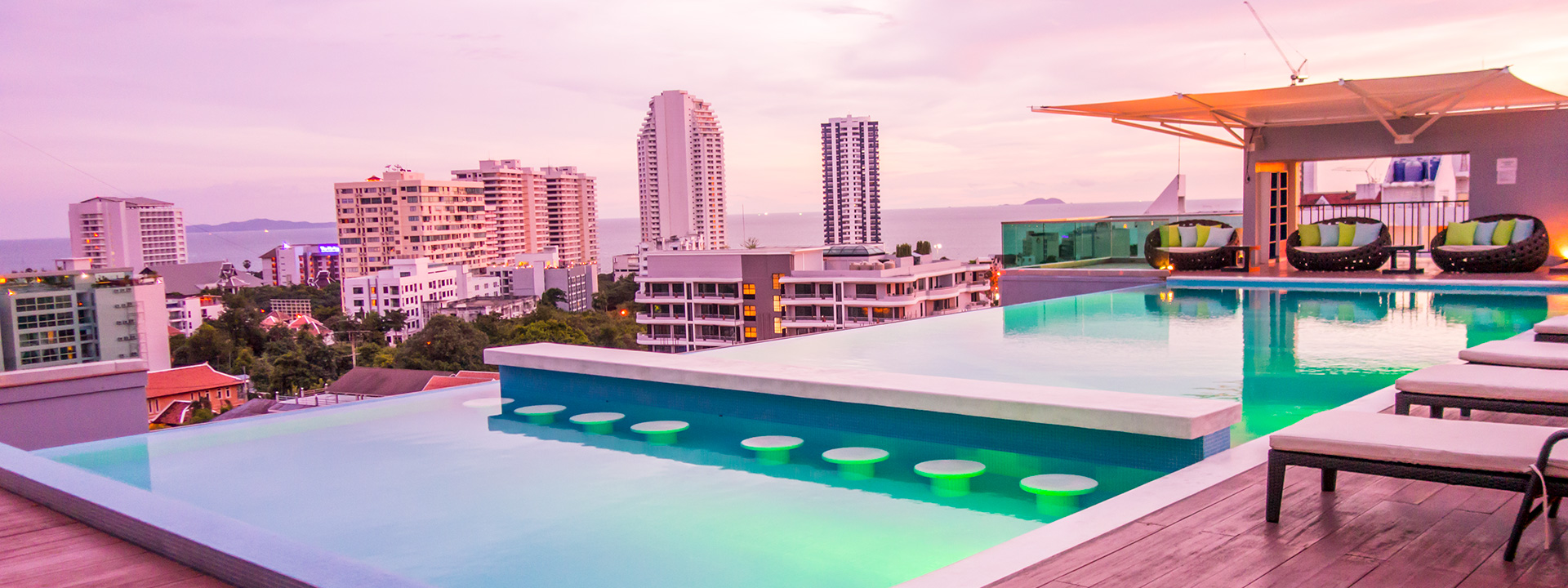 Cherish the Stunning Sunsets at the Infinity Swimming Pool on rooftop in Pratamnak mountain hotels overlooking the Jomtien and Pratamnak Bay.